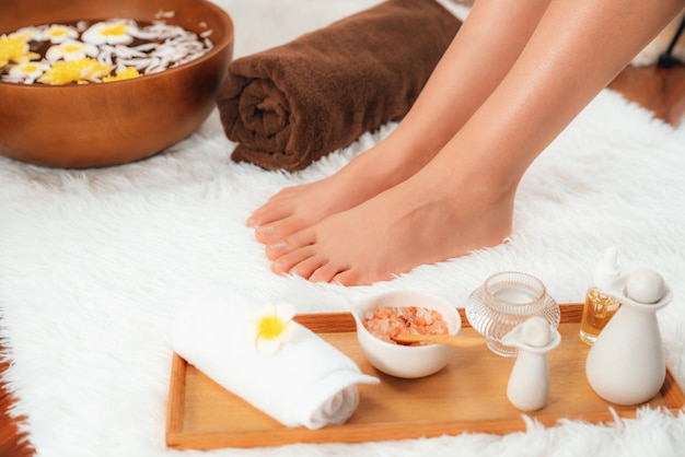 Woman indulges in blissful foot massage at luxurious spa salon Quiescent