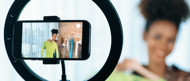 Woman influencer shoot live streaming vlog video review clothes crucial social