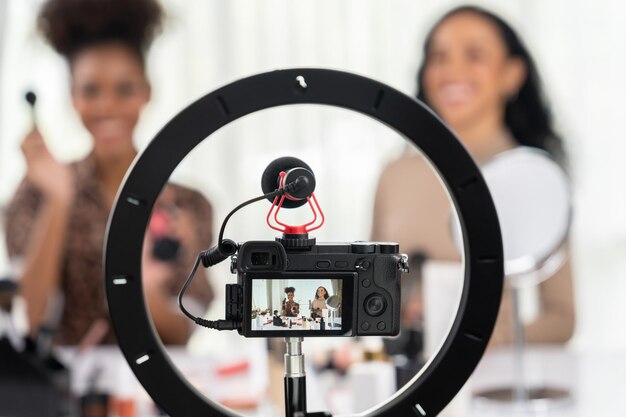 Woman influencer shoot live streaming vlog video review makeup crucial social