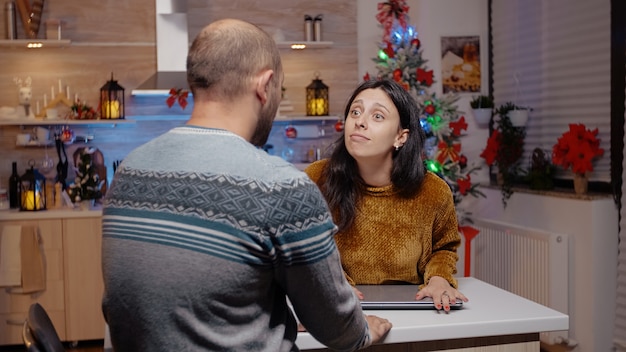 Woman interrupting business video call for man