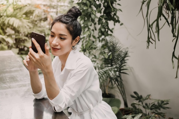 Woman is chatting with friend on cell phone