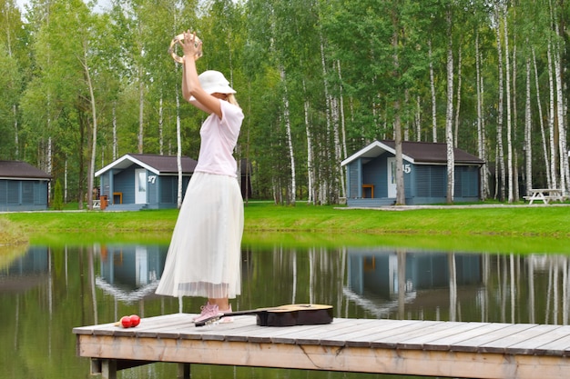 Woman is dancing on pier