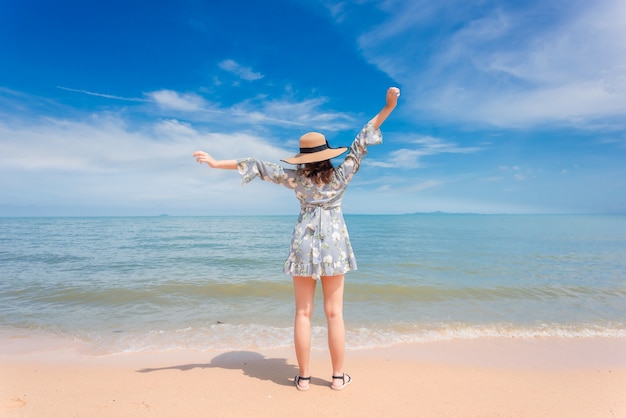 Woman is enjoying the beautiful seaside.