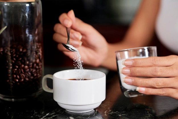 Woman is going to drink coffee