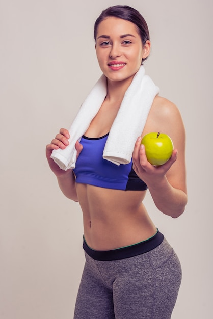 Woman is looking at front and smiling.