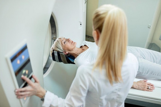 a woman is looking at her reflection in a mirror