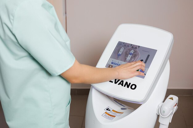 a woman is painting a machine with the word  croc  on it