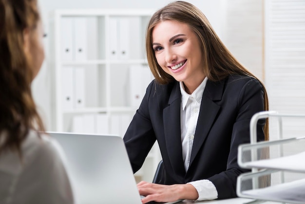 Woman is pleased to work with her colleague