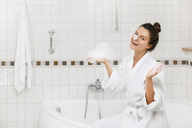 Woman is preparing to take a bath