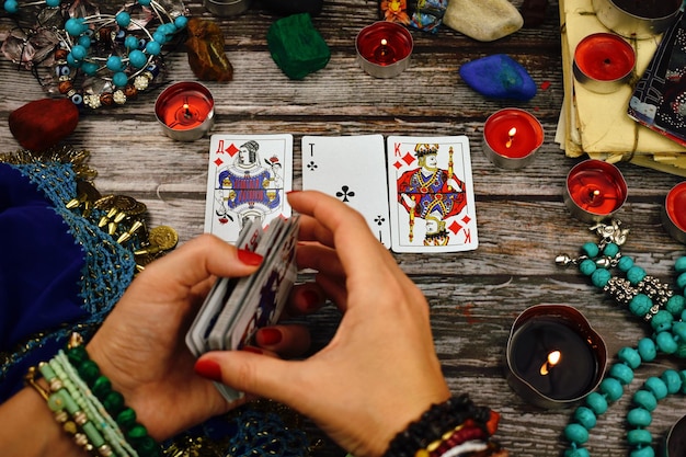 woman is a psychic prophet A psychic with Tarot cards Guessing the future Prediction of fate