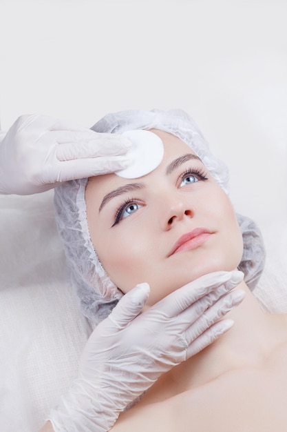 The woman is relaxingWoman Getting Facial Treatment in Beauty Salon