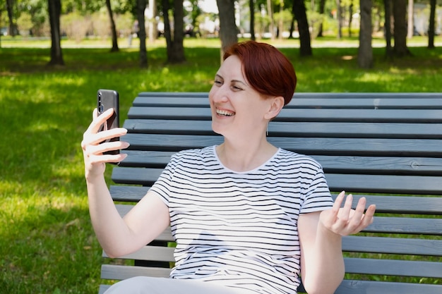 Woman is talking on a mobile phone and smiling