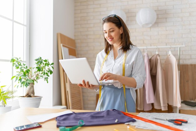 Woman is working at workshop. Concept of small business.