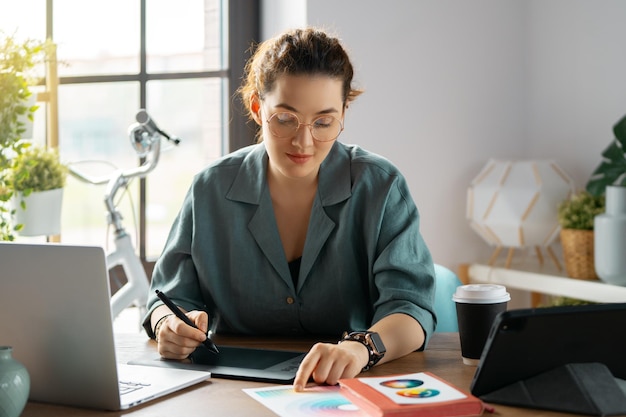 Woman is working at workshop