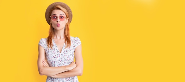 Woman isolated face portrait banner with copy space background happy funny young woman in straw hat and sunglasses on yellow background