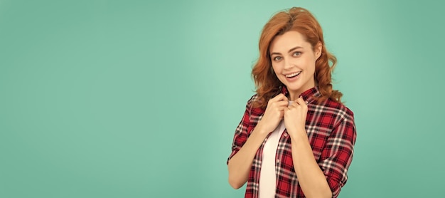 Woman isolated face portrait banner with mock up copyspace female model in checkered shirt pretty look of young smiling girl red haired woman