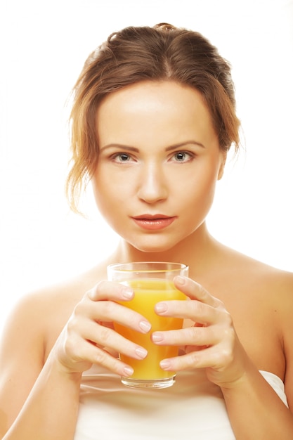 Woman isolated shot drinking orange juice