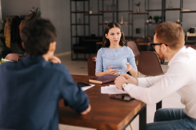 Woman job seeker at the interview the girl answers the interviewers questions