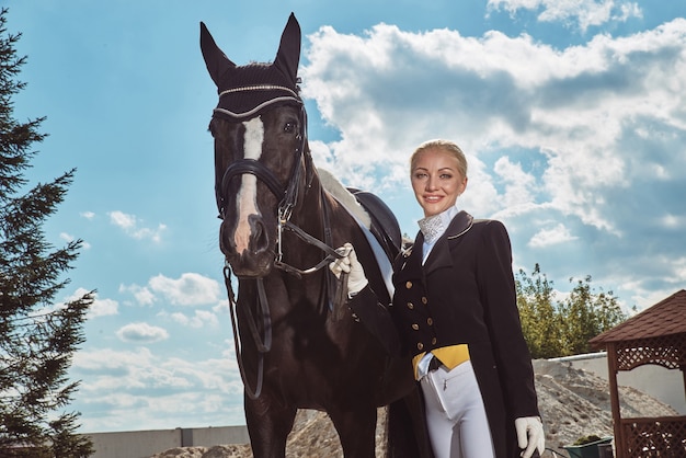 Woman jockey with his horse