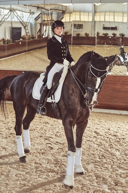 Woman jockey with his horse