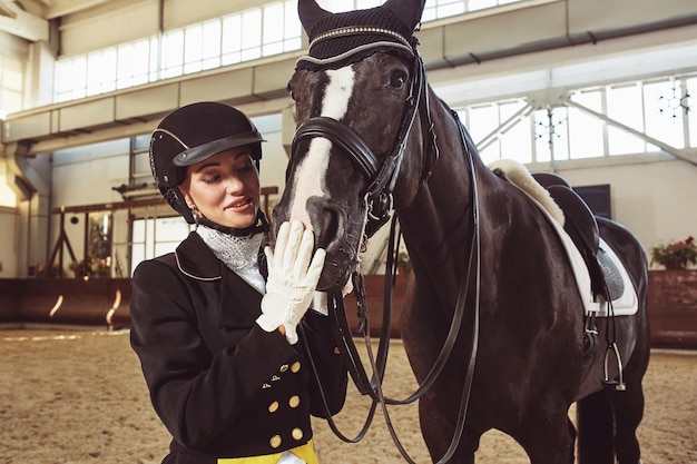 Woman jockey with his horse