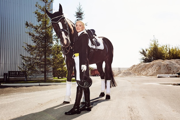 Woman jockey with his horse