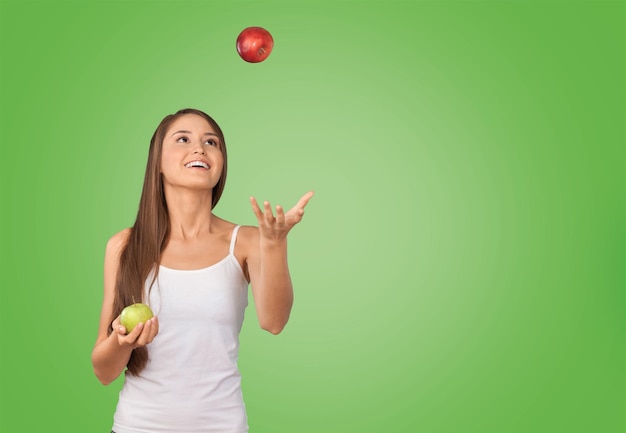 Woman juggling with apples