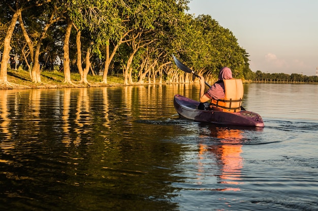 Woman in kayak boat in the water