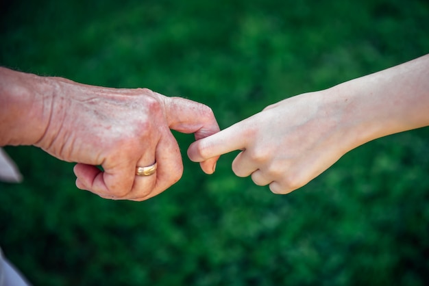 Woman and kid holding hands