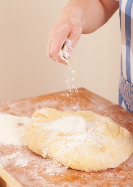 Woman kneading dough