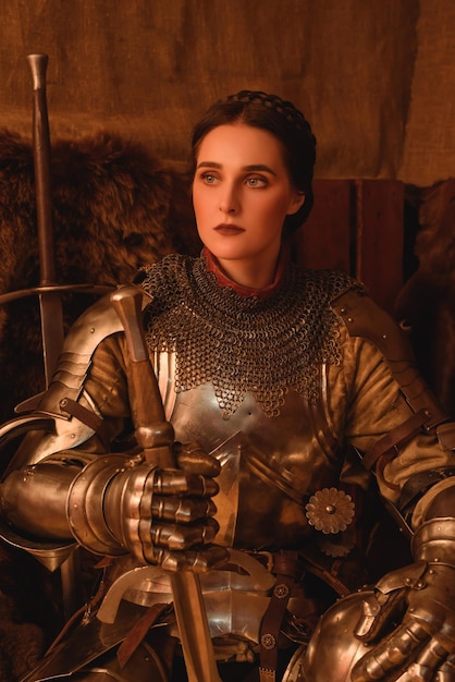 Woman knight in an armor with a sword