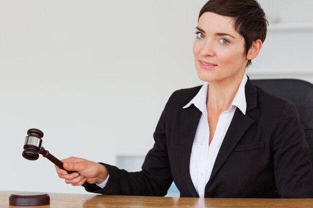 Woman knocking a gavel