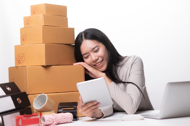 Woman labeling moving box at home