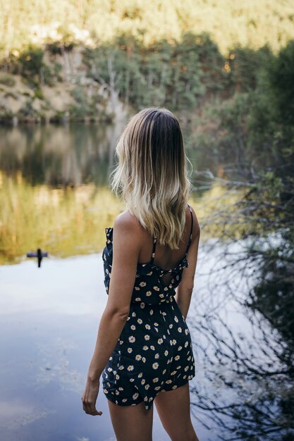 woman on a lake shore