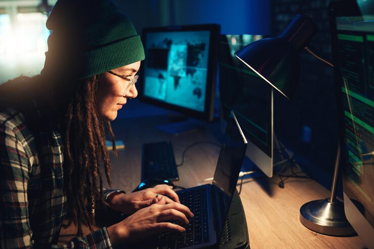 Photo woman laptop and hacker typing in home with software data programming or cybersecurity developer it coder and female focus on hacking phishing or malware code on computer for dark web at night