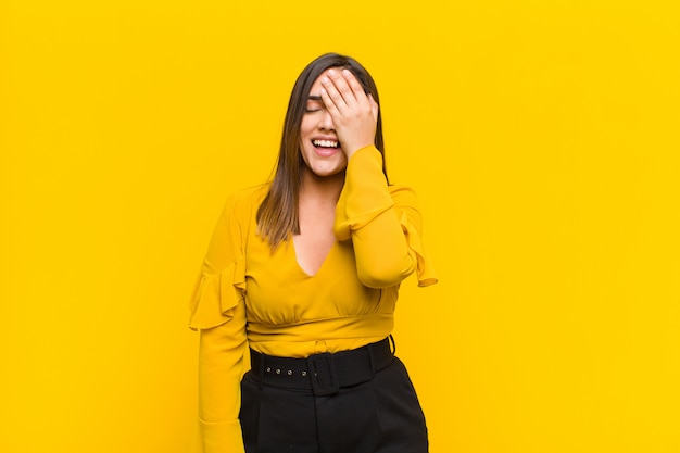 woman laughing and slapping forehead