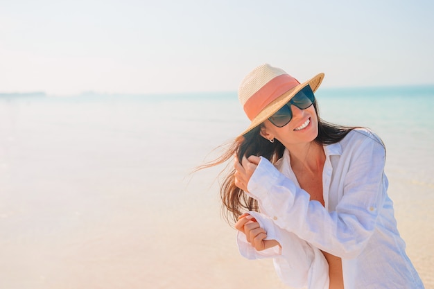 Woman laying on the beach enjoying summer holidays