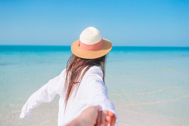 Woman laying on the beach enjoying summer holidays