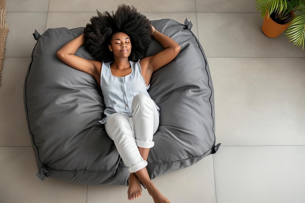 a woman laying on a bean bag chair