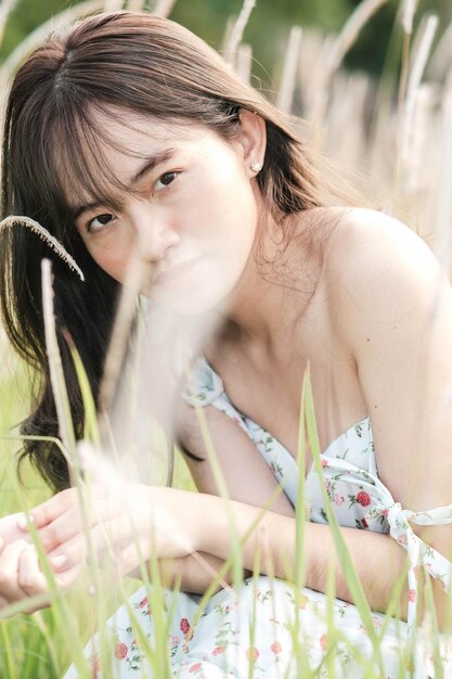 A woman laying in a field of grass