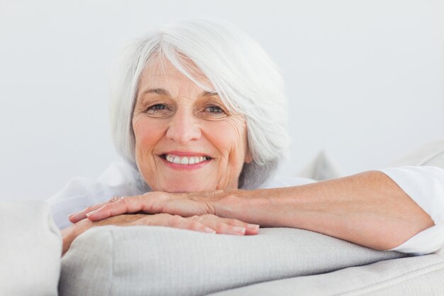 woman leaning on a couch