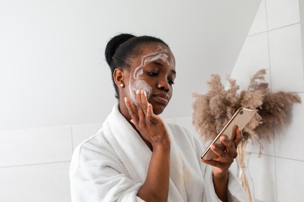 Woman learing to do skincare procedures at home