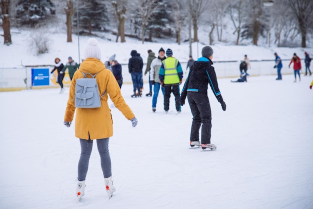 Woman learn to ski at city ice rink