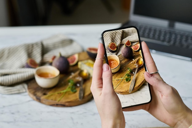 Woman learning to photograph still life