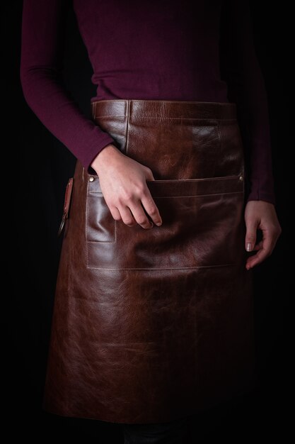 Woman in leather apron