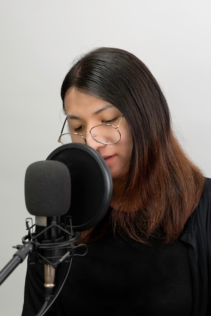 Woman LGBTQ singer sing a song with microphone