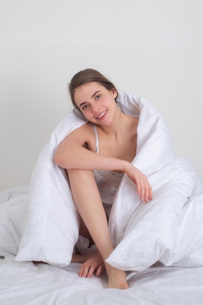 Woman lie in bed woke up after sleeping in morning enjoy new\
day enough sleep concept