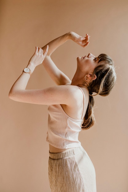 Woman in a light pink tank top