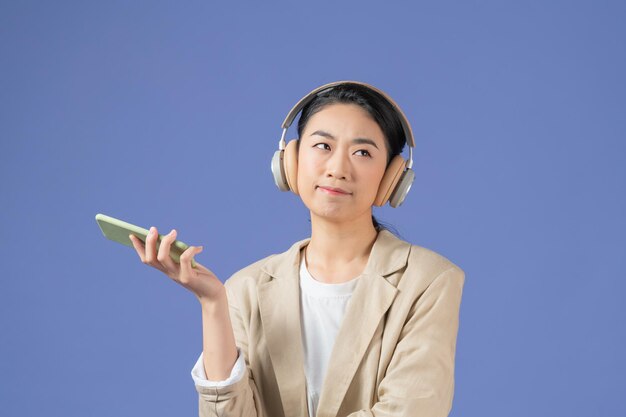 Woman listening to music in earbuds wireless headphones and rejoicing