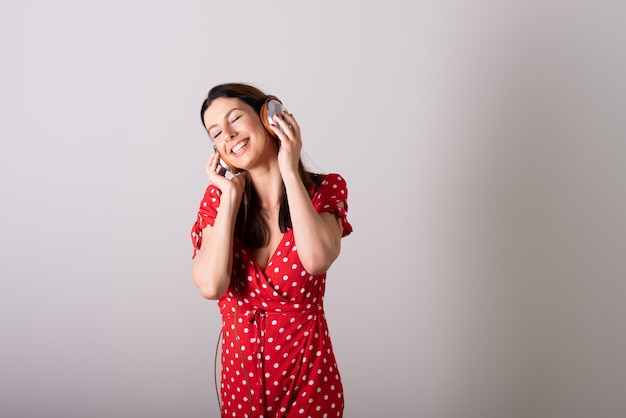 A woman listening to music and enjoying it